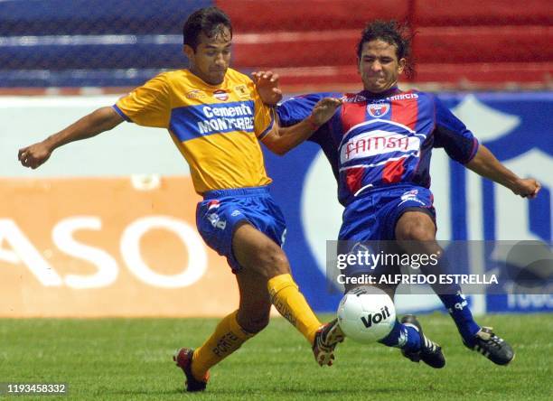 Brazilian Irenio Soarez , mid-fielder for the Tigres team of the Nuevo Leon University, fights for the ball with Eduardo Rergis, midfielder for the...