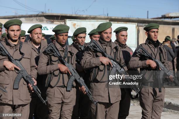 Local Policemen trained by Turkey take part in a ceremony to take office in Tal Abyad after the city center was cleared from PKK, listed as a...