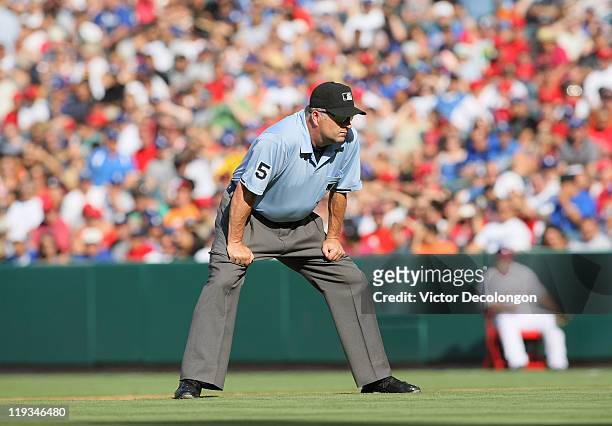 Second base umpire Dale Scott, #5 looks on from second base during the MLB game between the Los Angeles Dodgers and the Los Angeles Angels of Anaheim...