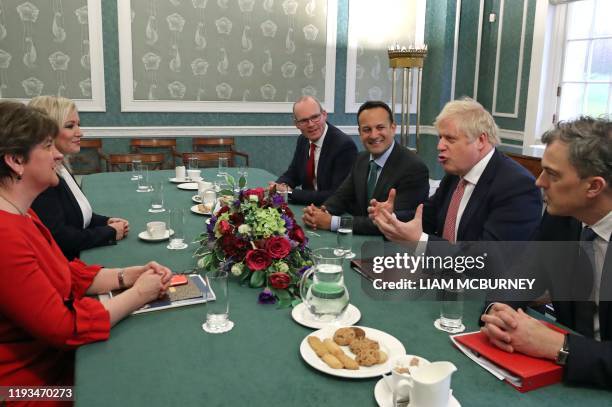 Northern Ireland's First Minister Arlene Foster and Deputy First Minister Michelle O'Neill, Ireland's Foreign Minister Simon Coveney, Ireland's Prime...