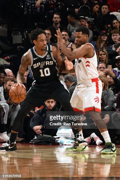 DeMar DeRozan of the San Antonio Spurs handles the ball against Kyle Lowry of the Toronto Raptors on January 12, 2020 at the Scotiabank Arena in...