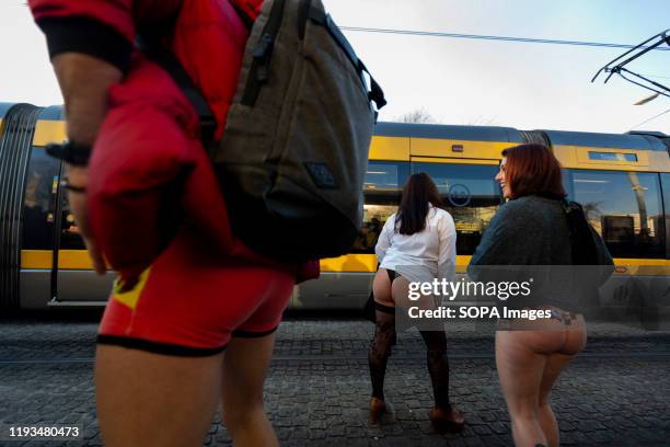 People with no pants wait in the subway. The annual No Pants Subway Ride took place in 20 major cities across the globe, the event was created in...