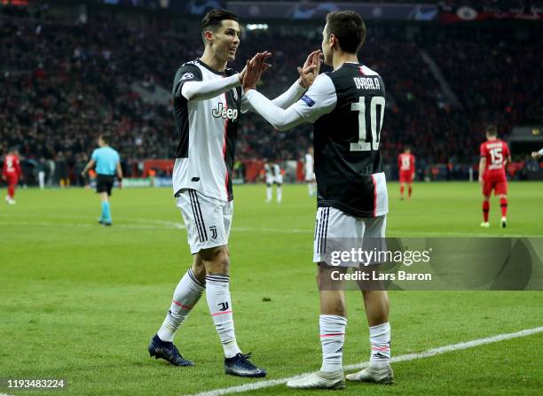 Cristiano Ronaldo of Juventus celebrates with Paulo Dybala of Juventus after scoring his teams first goal during the UEFA Champions League group D...