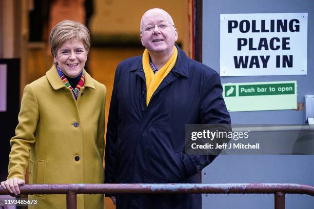First Minister of Scotland and leader of the SNP Nicola Sturgeon votes with her husband Peter Murrell at Broomhouse Community Hall in Ballieston on...