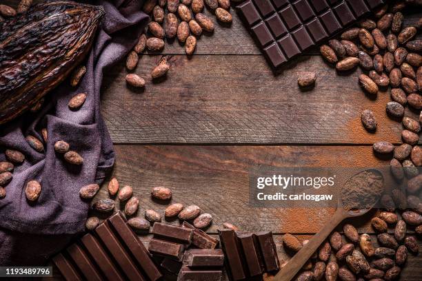 chocolate bars and cocoa frame - cocoa bean stock pictures, royalty-free photos & images