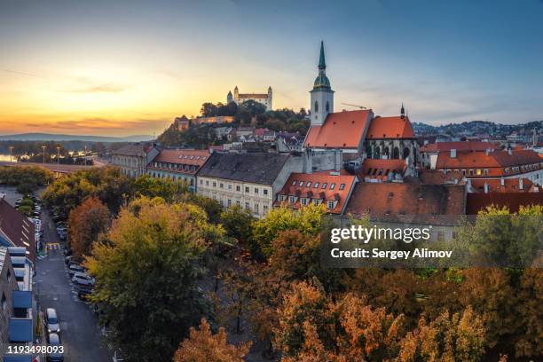 evening dawn over bratislava castle and old town district - bratislava stockfoto's en -beelden