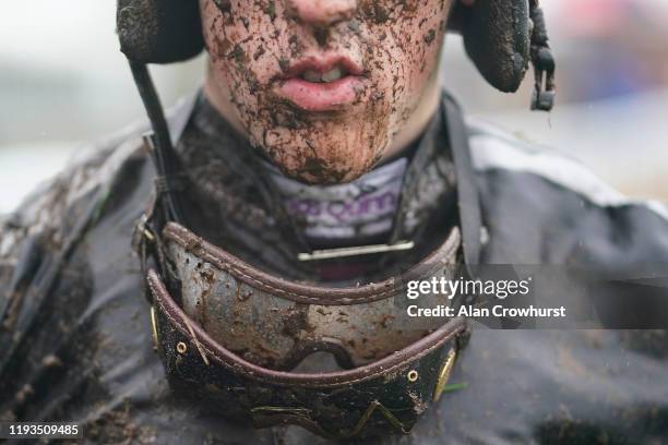 Wet and muddy Ciaran Gethings at Warwick Racecourse on December 12, 2019 in Warwick, England.