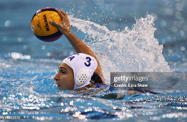 Marina Zablith of Brazil swims with the ball against Greece during her Women's Water Polo first preliminary round match on Day Four of the 14th FINA...