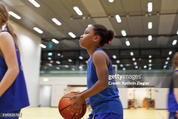 girls' basketball team practicing indoors, focus on one girl - learning agility stock pictures, royalty-free photos & images