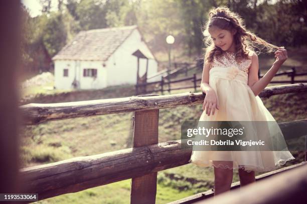 girl in beautiful dress walking on the wooden bridge - angel white dress stock pictures, royalty-free photos & images