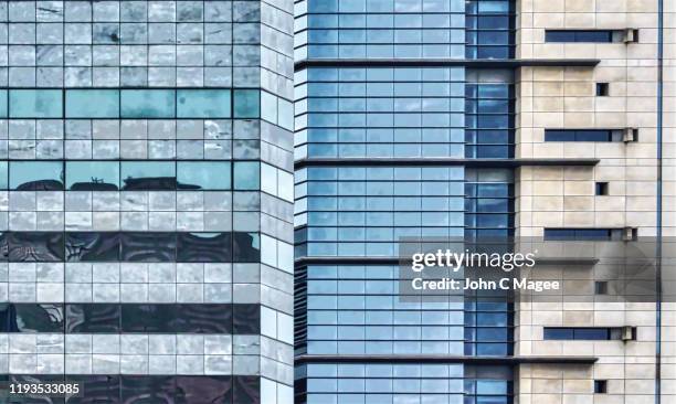 two tall buildings - blue glass stock pictures, royalty-free photos & images