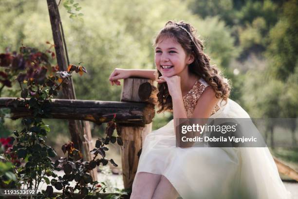 little girl in elegant white dress enjoys nature - white dress stock pictures, royalty-free photos & images