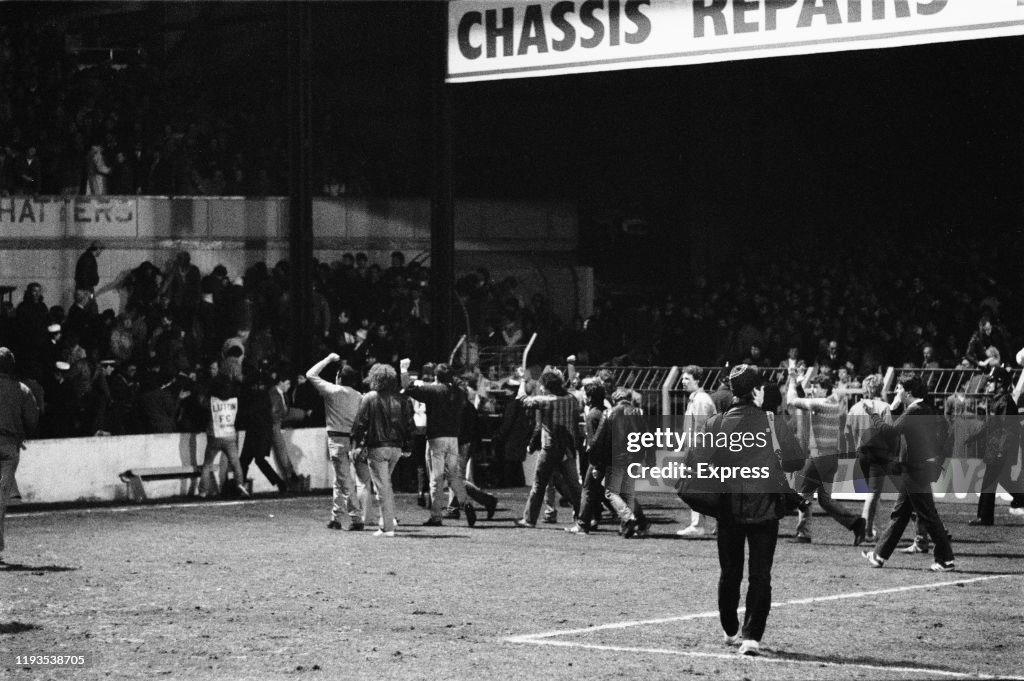 Luton Riots Fans invade the field during the