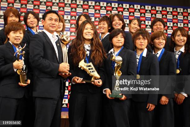Mana Iwabuchi, Aya Miyama, Japan team coach Norio Sasaki, Homare Sawa, Shinobu Ohno, Asuna Tanaka, Nahomi Kawasumi and Aya Sameshima attend a press...