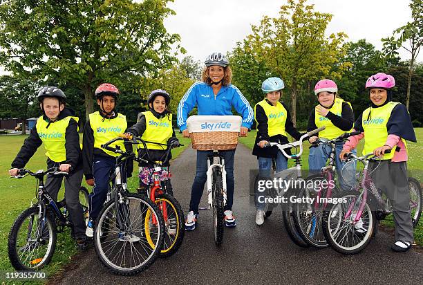 Actress and TV presenter, Angela Griffin poses with children from Peel Park Primary School ahead of Sky Ride Bradford - a free mass participation...