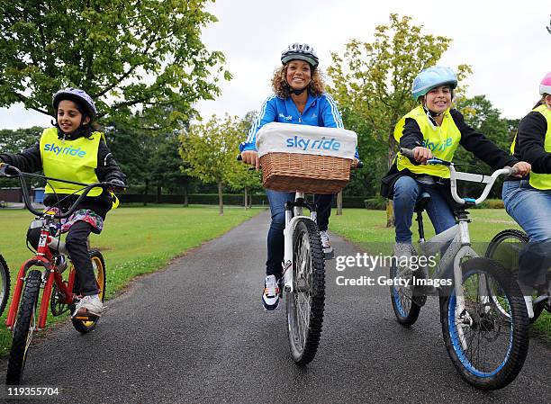 Actress and TV presenter, Angela Griffin poses with children from Peel Park Primary School ahead of Sky Ride Bradford - a free mass participation...