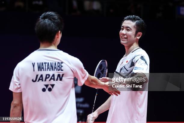 Hiroyuki Endo and Yuta Watanabe of Japan react in the Men's Doubles round robin match against Marcus Fernaldi Gideon and Kevin Sanjaya Sukamuljo of...