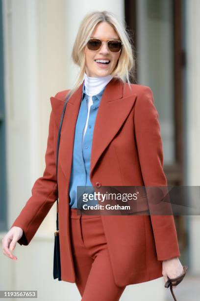 Martha Hunt is seen wearing a Michael Kors suit with Thakoon shirt, Celine handbag and Randolph sunglasses in Tribeca on December 12, 2019 in New...