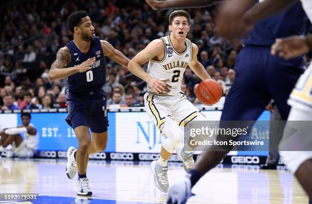 Villanova Guard Collin Gillespie brings the ball into the key against Georgetown Guard Jahvon Blair in the first half during the game between the...