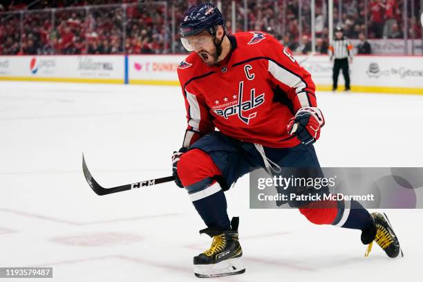 Alex Ovechkin of the Washington Capitals celebrates after scoring his first goal of the game against the Carolina Hurricanes in the first period at...