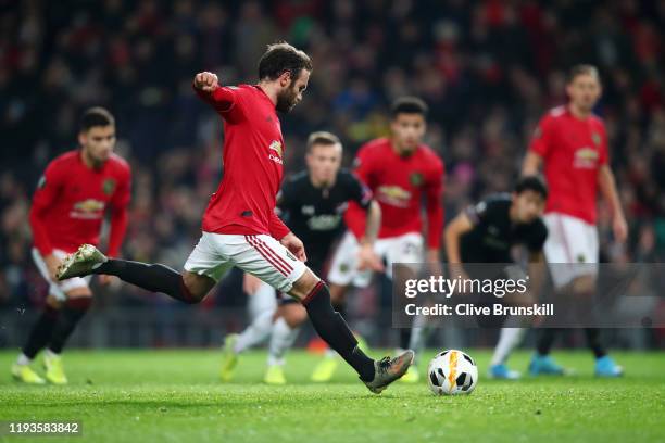 Juan Mata of Manchester United scores his team's third goal during the UEFA Europa League group L match between Manchester United and AZ Alkmaar at...