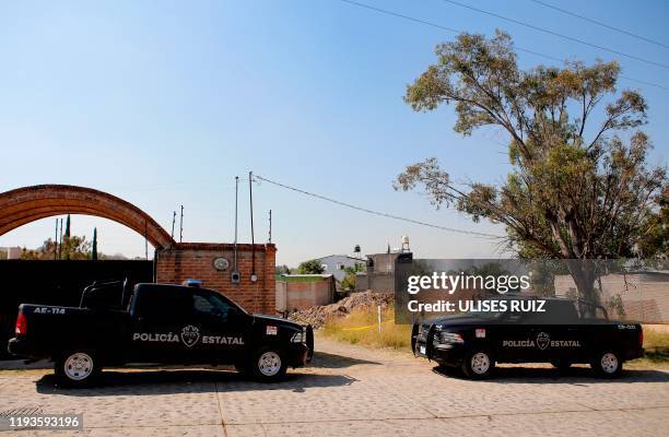 Police vehicles are seen in the area where a clandestine mass grave was discovered at El Mirador neighbourhood in Tlajomulco de Zuniga, Jalisco...