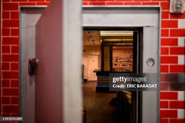 The discreet entrance of the Capo Speakeasy bar and club is open inside a Deli shop in Washington,DC on January 3, 2020. - A century after the United...