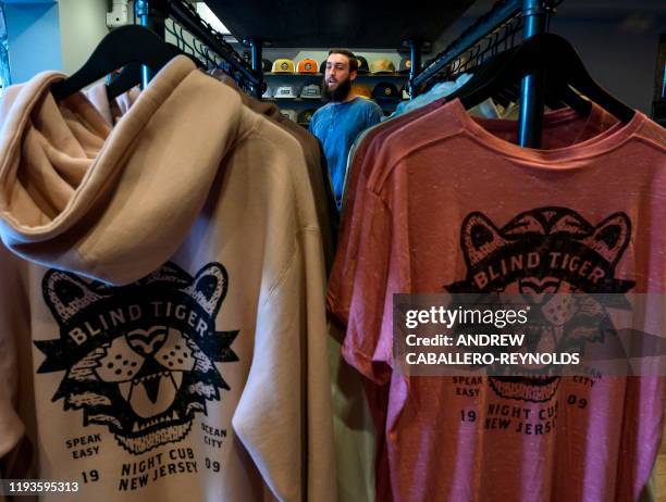 Eric Plyler looks on in his Dry Island store, capitalizing on the fact that Ocean City is a city where alcohol is not allowed, near merchandise...