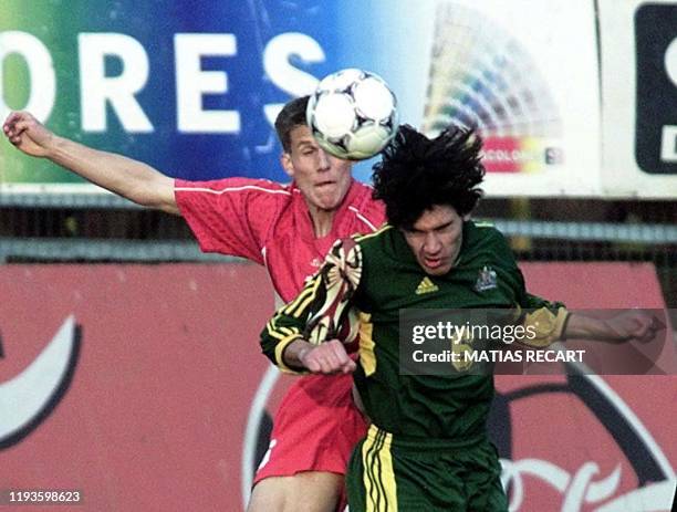 Australian forward Wayne Jroir heads the ball against an unidentified member of the Canadian national team in a World Cup qualifying match played in...