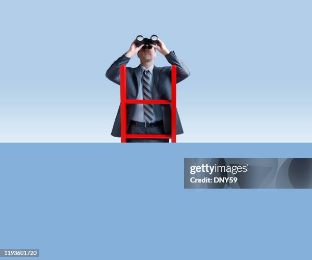 businessman standing on ladder looking through binoculars - spy glass businessman stock pictures, royalty-free photos & images