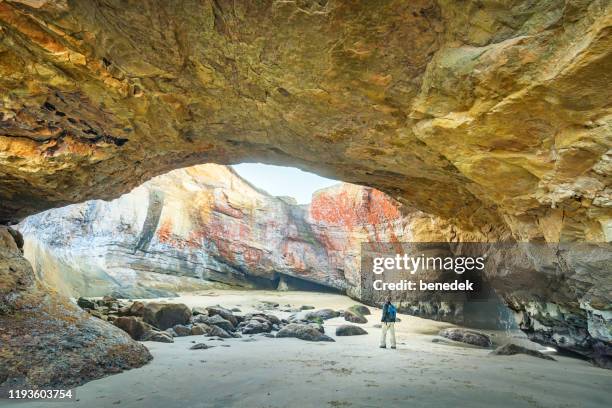 hiker at devils punchbowl state park oregon usa - oregon coast stock pictures, royalty-free photos & images