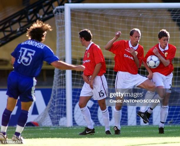 Th shot by Goran Lozanovski of South Melbourne is blocked by Manchester United players Jonathan Greening , Mark Wilson and Henning Berg during their...
