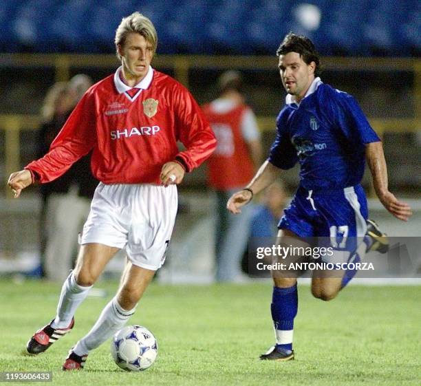 Manchester United golden boy David Beckham moved the ball past Jim Tsekinis of South Melbourne during their World Club Championship match 11 January...