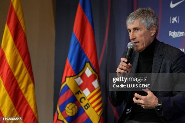 Barcelona's new coach Quique Setien gives a press conference during his official presentation in Barcelona on January 14 after signing his new...