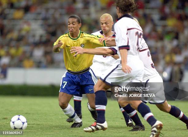 Ronaldinho of Brazil is surrounded by US players during their Group B Copa FIFA Confederaciones match in Guadalajara, Mexico 28 July 1999. Brazil...