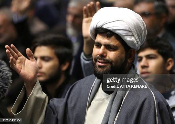 Supporter of the Basij, a militia loyal to the Islamic republic's establishment, attends a memorial for the victims of the Ukraine plane crash in...