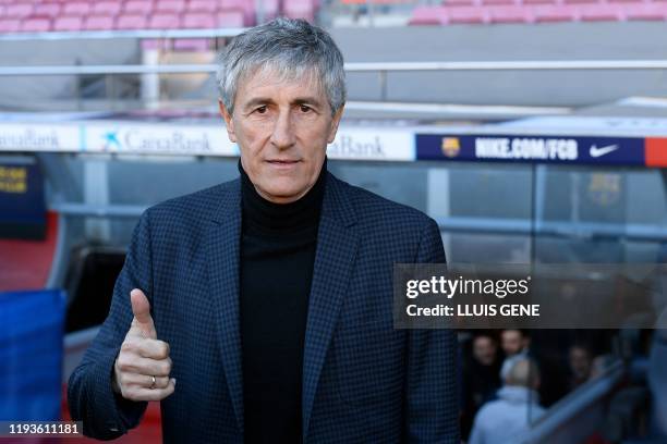 Barcelona's new coach Quique Setien poses during his official presentation at the Camp Nou stadium in Barcelona on January 14, 2020.