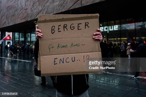 Demonstrator hold a banner with anti-cfdt union slogan at a Demonstration against retirement reform in Rennes, France on December 14th, 2020....