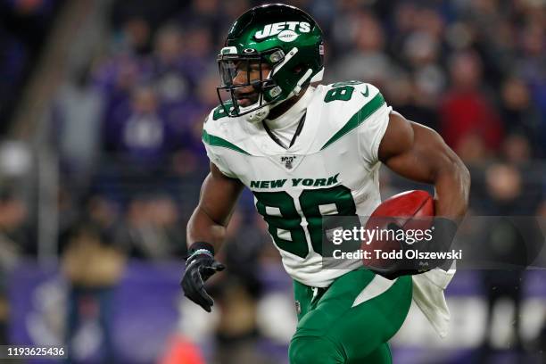 Running back Ty Montgomery of the New York Jets carries the ball during first quarter against the Baltimore Ravens at M&T Bank Stadium on December...