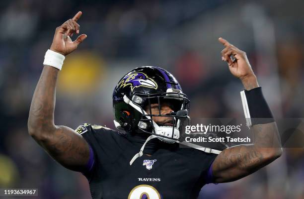 Quarterback Lamar Jackson of the Baltimore Ravens celebrates a touchdown pass in the third quarter of the game against the New York Jets at M&T Bank...
