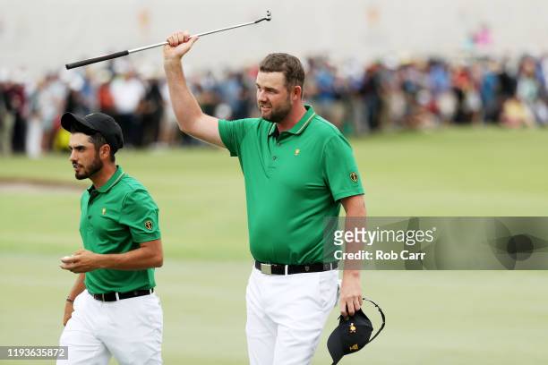 Marc Leishman of Australia and the International team and Abraham Ancer of Mexico and the International team celebrate their 3&2 win over Webb...
