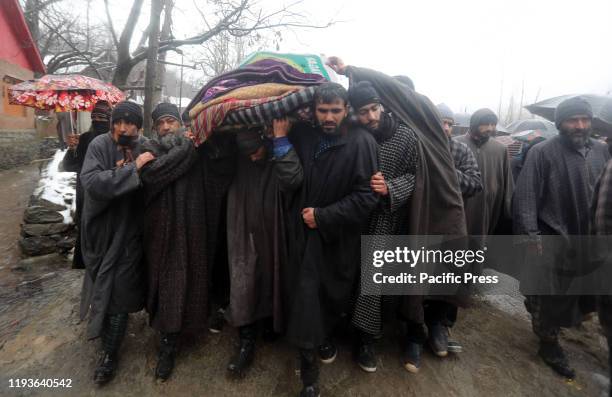 Villagers carry the dead body of top rebel commander Umer Fayaz alias Hammad Khan during his funeral ceremony in Tral area of south Kashmir.Three...