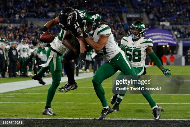 Running back Mark Ingram of the Baltimore Ravens scores a touchdown during the fourth quarter against the New York Jets at M&T Bank Stadium on...