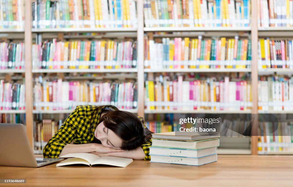 Tired Library Tired Woman Sleeping In The Library High-Res Stock Photo - Getty Images