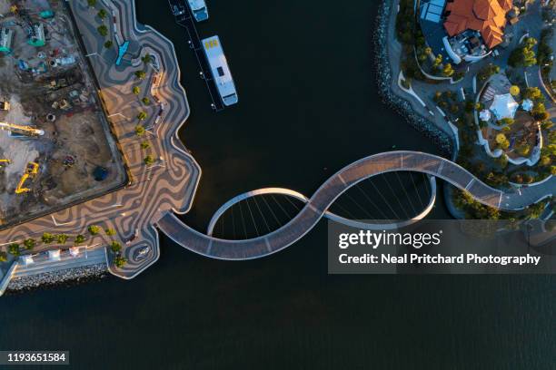 aerial view over the footbridge at elizabeth quay perth western australia - perth australia stock pictures, royalty-free photos & images