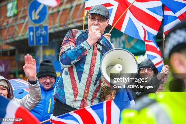 Pro-Unionist group leader Alistair McConnachie is seen shouting over his megaphone during the counter-protest. 80,000 supporters came out in support...