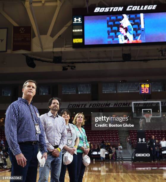 Late head coach of the Boston College women's basketball team Cathy Inglese is shown on the scoreboards at Silvio O. Conte Forum in Boston while her...