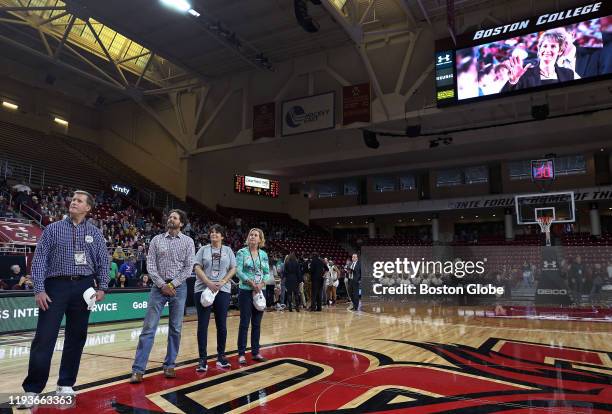 Late head coach of the Boston College women's basketball team Cathy Inglese is shown on the scoreboards at Silvio O. Conte Forum in Boston while her...