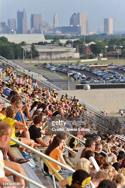Fans watch a game between the Columbus Crew and the San Jose Earthquakes with the skyline of the city of Columbus in the background on July 16, 2011...
