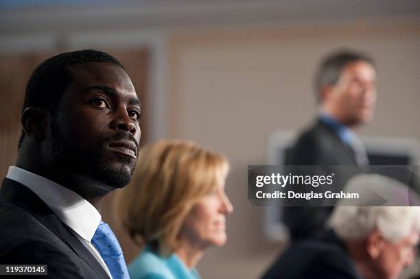 Quarterback Michael Vick; Betty Sutton, D-Ohio; Rep. James Moran, D-Va.; and Wayne Pacelle, president and CEO of the Humane Society of the United...